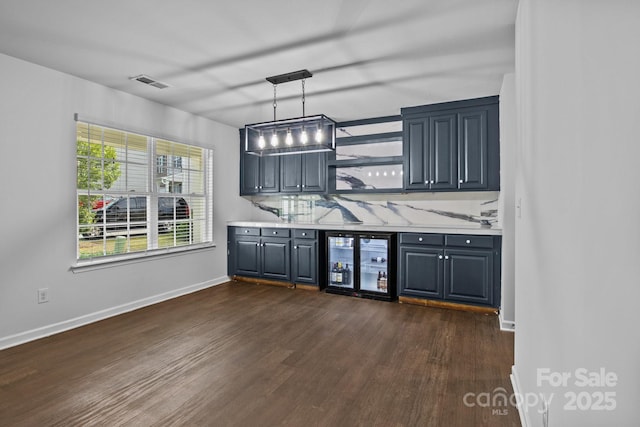 2021 Tarzi Ln, Charlotte, NC 28215 - indoor bar featuring wine cooler, dark wood finished floors, and hanging light fixtures