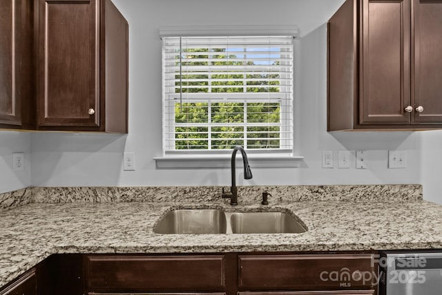 2021 Tarzi Ln, Charlotte, NC 28215 - kitchen featuring dishwasher, dark brown cabinetry, and light stone countertops