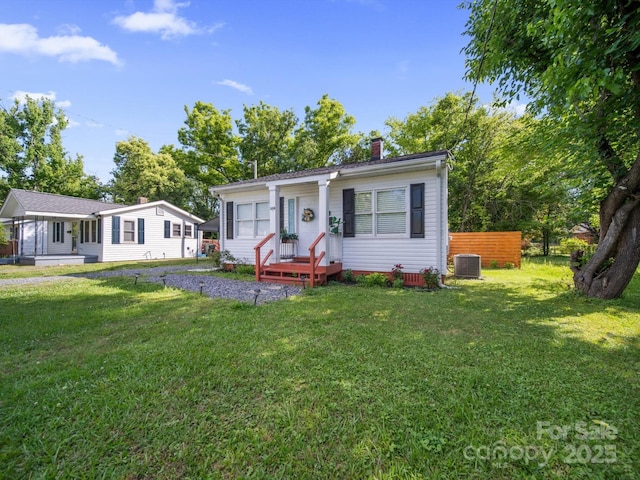 339 Arnold St, Rock Hill, SC 29730 - view of front of property with a chimney, central AC unit, and a front lawn