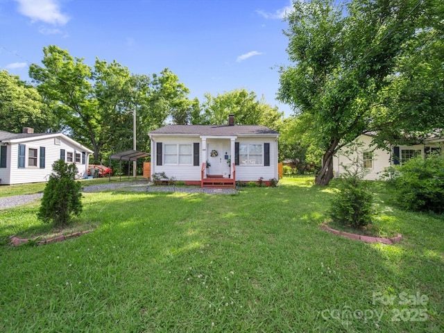 339 Arnold St, Rock Hill, SC 29730 - view of front of house featuring a chimney, a front yard, and a carport