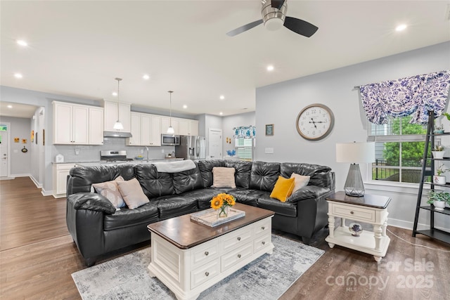 5079 Skyfest Dr, Charlotte, NC 28215 - living area featuring dark wood-style floors, baseboards, recessed lighting, and a ceiling fan