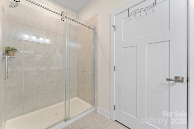 5079 Skyfest Dr, Charlotte, NC 28215 - full bathroom featuring a shower stall, tile patterned floors, and baseboards