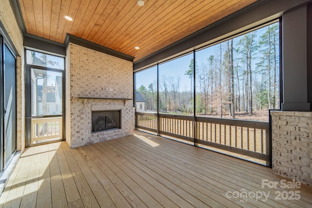608 Deodar Cedar Dr Unit 69, Matthews, NC 28104 - unfurnished sunroom with an outdoor brick fireplace and plenty of natural light