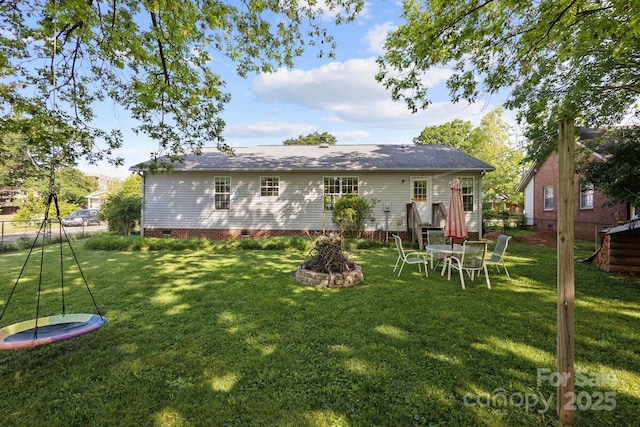 3721 Conway Ave, Charlotte, NC 28209 - back of property with crawl space and an outdoor fire pit