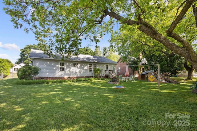 3721 Conway Ave, Charlotte, NC 28209 - back of house featuring a playground, crawl space, and a yard