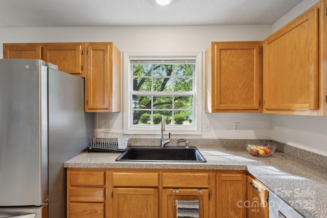 3721 Conway Ave, Charlotte, NC 28209 - kitchen with freestanding refrigerator, a sink, and tile counters