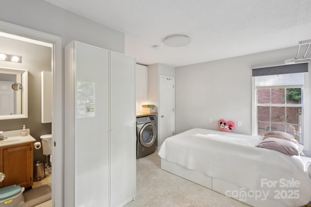 3721 Conway Ave, Charlotte, NC 28209 - bedroom with washer / dryer, a sink, and ensuite bath