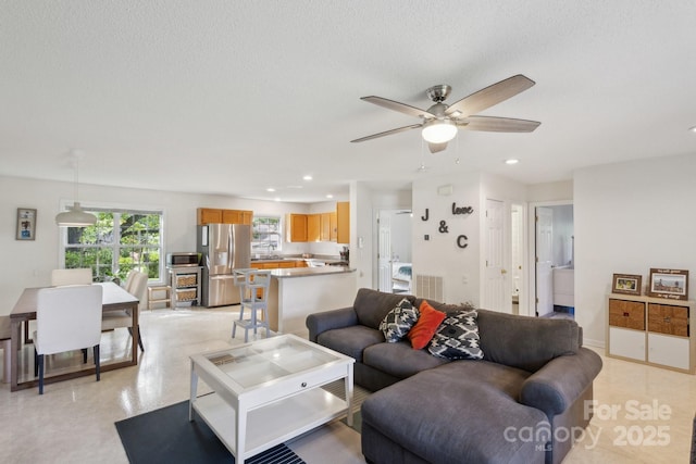 3721 Conway Ave, Charlotte, NC 28209 - living area featuring a ceiling fan, recessed lighting, and a textured ceiling