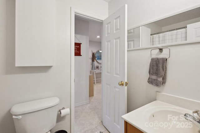 3721 Conway Ave, Charlotte, NC 28209 - full bath with vanity, toilet, and tile patterned flooring