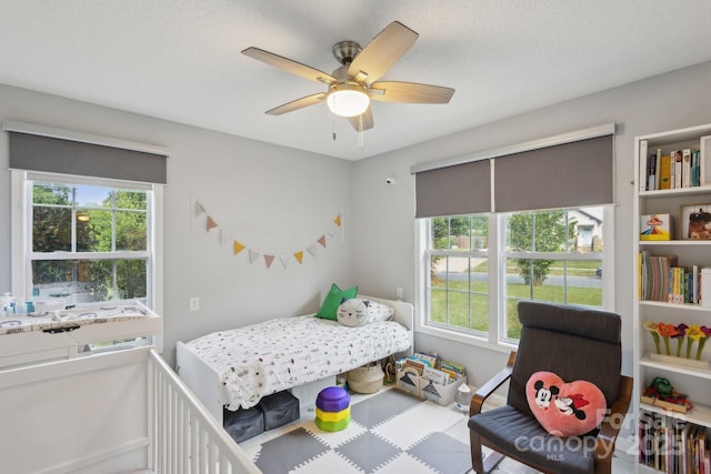 3721 Conway Ave, Charlotte, NC 28209 - bedroom with multiple windows, baseboards, and a ceiling fan