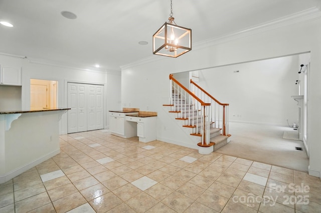 201 Limerick Dr, Matthews, NC 28104 - stairway featuring ornamental molding, tile patterned floors, a chandelier, recessed lighting, and baseboards