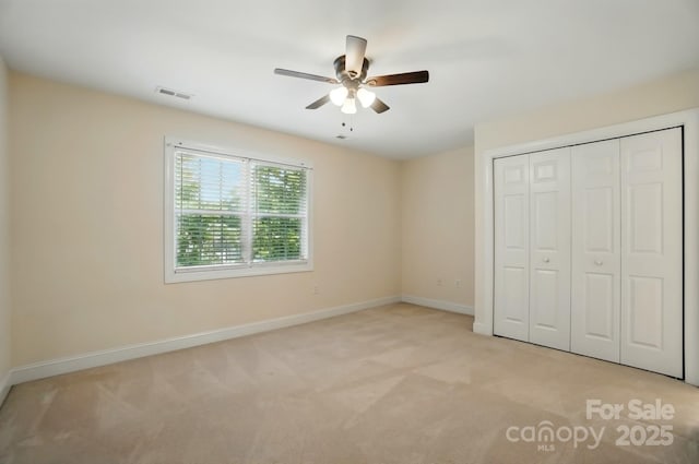 201 Limerick Dr, Matthews, NC 28104 - unfurnished bedroom with light colored carpet, baseboards, a closet, and a ceiling fan