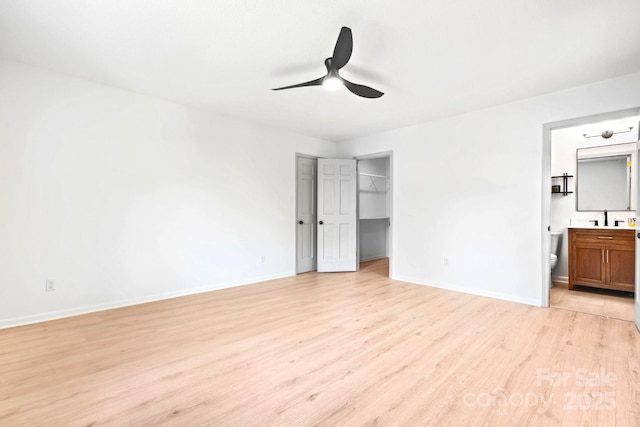201 Forest Rd, Taylorsville, NC 28681 - unfurnished bedroom featuring light wood-type flooring, baseboards, and connected bathroom