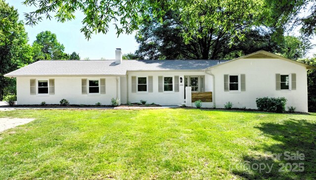 201 Forest Rd, Taylorsville, NC 28681 - ranch-style house featuring a chimney and a front lawn