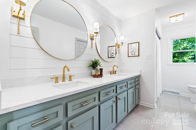 201 Forest Rd, Taylorsville, NC 28681 - full bathroom featuring double vanity, tile patterned floors, toilet, and baseboards
