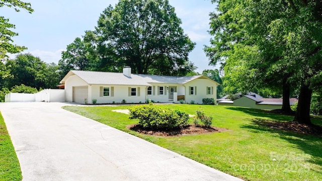 201 Forest Rd, Taylorsville, NC 28681 - ranch-style house featuring an attached garage, driveway, a chimney, and stucco siding