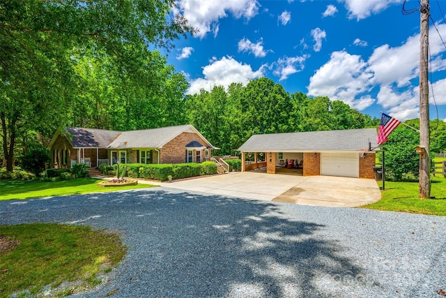 7712 Old Waxhaw Monroe Rd, Waxhaw, NC 28173 - ranch-style home with concrete driveway, brick siding, and a carport