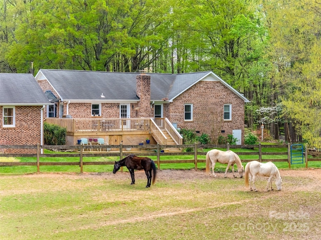 7712 Old Waxhaw Monroe Rd, Waxhaw, NC 28173 - view of front of house with brick siding, a chimney, and a wooden deck