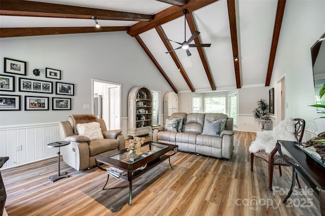 7712 Old Waxhaw Monroe Rd, Waxhaw, NC 28173 - living area featuring beam ceiling, a ceiling fan, light wood-style floors, high vaulted ceiling, and wainscoting