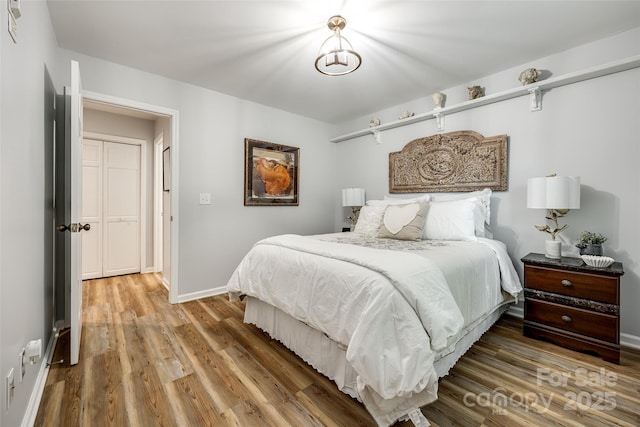 7712 Old Waxhaw Monroe Rd, Waxhaw, NC 28173 - bedroom featuring wood finished floors and baseboards