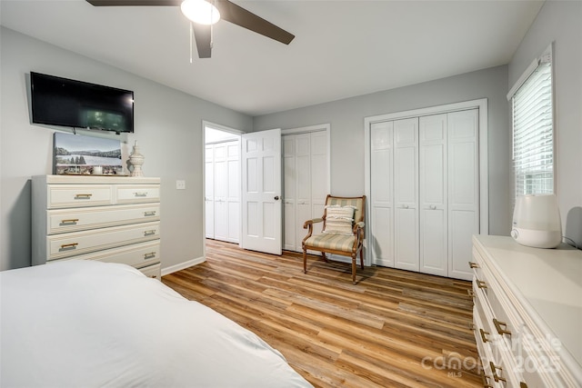 7712 Old Waxhaw Monroe Rd, Waxhaw, NC 28173 - bedroom featuring multiple closets, light wood-style flooring, and ceiling fan