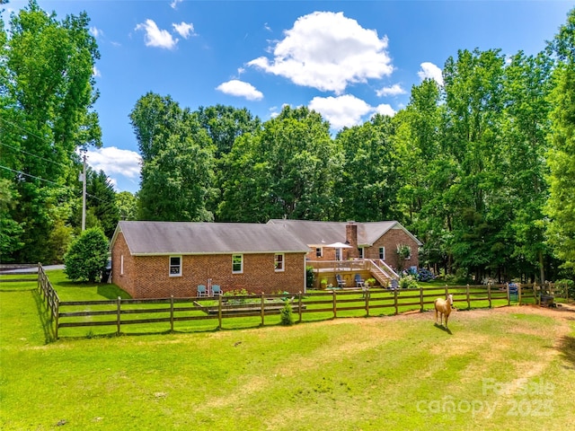 7712 Old Waxhaw Monroe Rd, Waxhaw, NC 28173 - view of front facade with brick siding, a chimney, stairs, and a wooden deck