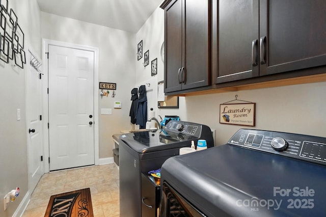 10903 Skymont Dr, Huntersville, NC 28078 - washroom with cabinet space, washing machine and dryer, and baseboards
