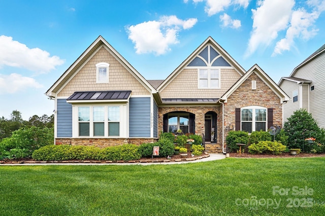 10903 Skymont Dr, Huntersville, NC 28078 - craftsman house featuring a standing seam roof, stone siding, a front yard, and metal roof