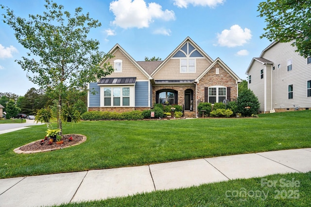 10903 Skymont Dr, Huntersville, NC 28078 - craftsman-style home featuring stone siding, a front lawn, a standing seam roof, and metal roof