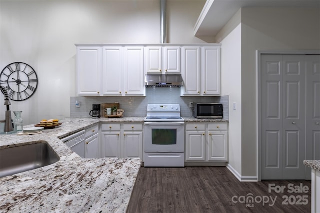 4637 Willow Glen Rd, Harrisburg, NC 28075 - kitchen featuring stainless steel appliances, under cabinet range hood, decorative backsplash, and white cabinetry