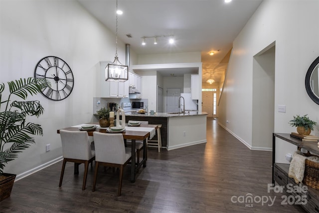 4637 Willow Glen Rd, Harrisburg, NC 28075 - dining area featuring dark wood-type flooring, baseboards, and track lighting