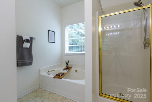 4637 Willow Glen Rd, Harrisburg, NC 28075 - bathroom with a stall shower, a bath, and baseboards