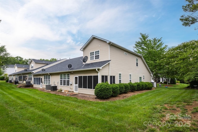 4637 Willow Glen Rd, Harrisburg, NC 28075 - rear view of property featuring a sunroom, a yard, and central AC unit