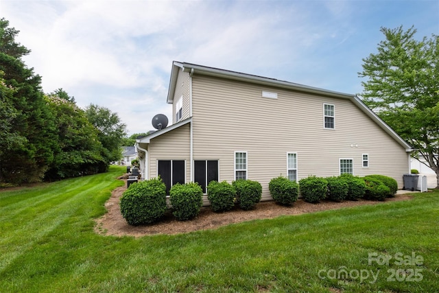 4637 Willow Glen Rd, Harrisburg, NC 28075 - view of side of home featuring a lawn and central AC