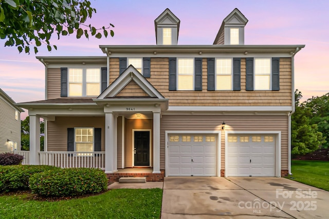 9641 Bellamy Pl NW, Concord, NC 28027 - view of front of home featuring an attached garage, concrete driveway, and a porch