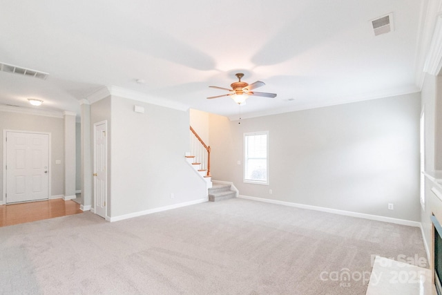 9641 Bellamy Pl NW, Concord, NC 28027 - empty room with ornamental molding, stairway, light carpet, a ceiling fan, and baseboards