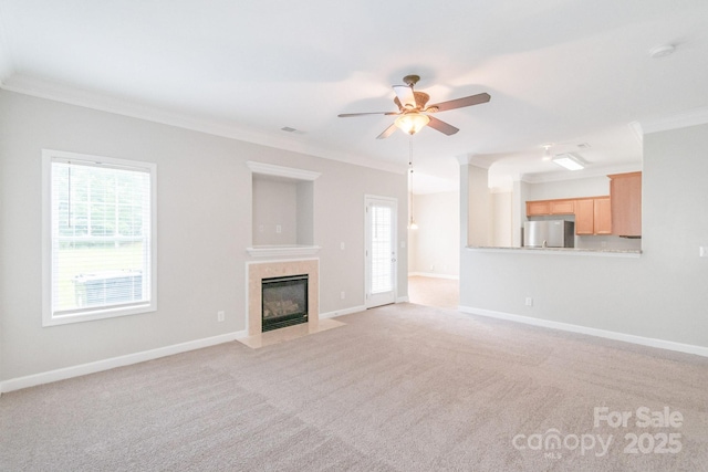 9641 Bellamy Pl NW, Concord, NC 28027 - unfurnished living room with crown molding, a ceiling fan, light colored carpet, baseboards, and a fireplace