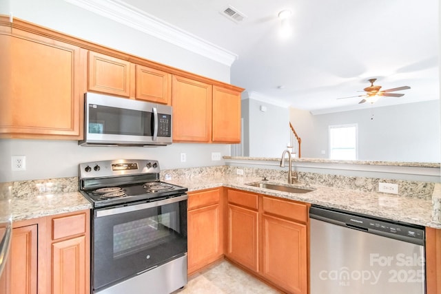 9641 Bellamy Pl NW, Concord, NC 28027 - kitchen with appliances with stainless steel finishes, a sink, crown molding, light stone countertops, and a ceiling fan