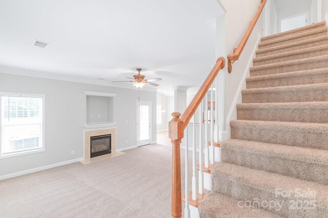 9641 Bellamy Pl NW, Concord, NC 28027 - stairway with carpet, a premium fireplace, a ceiling fan, and baseboards