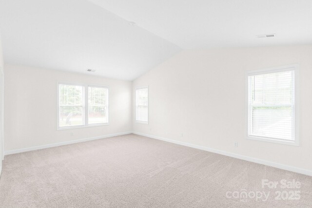 9641 Bellamy Pl NW, Concord, NC 28027 - spare room with vaulted ceiling, light carpet, and baseboards