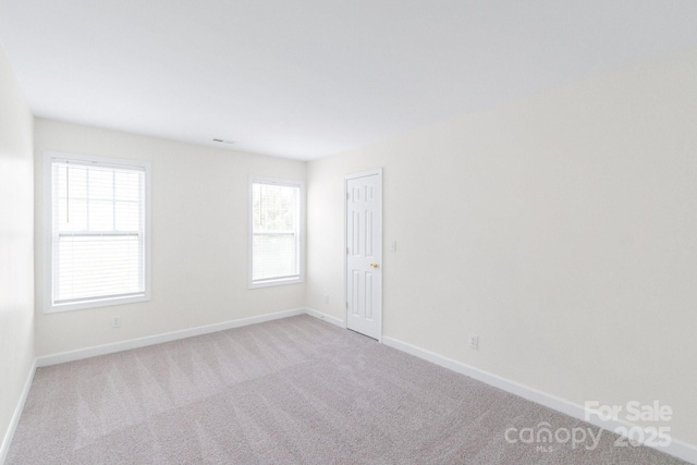 9641 Bellamy Pl NW, Concord, NC 28027 - empty room featuring baseboards and carpet