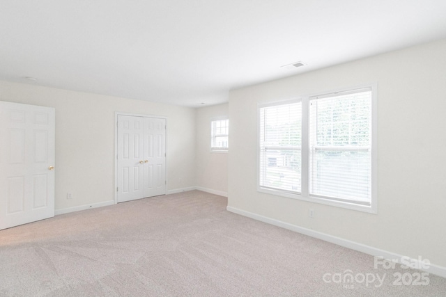 9641 Bellamy Pl NW, Concord, NC 28027 - spare room with light colored carpet and baseboards