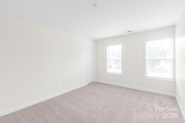 9641 Bellamy Pl NW, Concord, NC 28027 - empty room featuring light carpet and baseboards