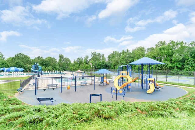 9641 Bellamy Pl NW, Concord, NC 28027 - community play area featuring a community pool and view of wooded area