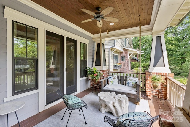 2221 Kenmore Ave, Charlotte, NC 28204 - wooden porch with ceiling fan