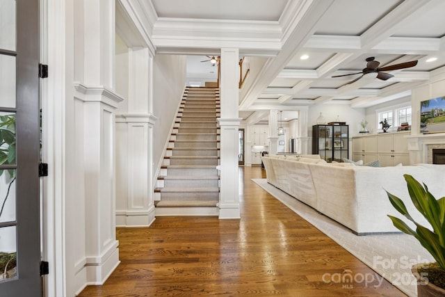 2221 Kenmore Ave, Charlotte, NC 28204 - entryway featuring ceiling fan, stairway, beam ceiling, coffered ceiling, and wood finished floors