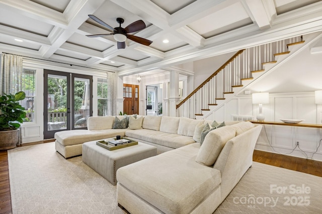 2221 Kenmore Ave, Charlotte, NC 28204 - living area with wood finished floors, plenty of natural light, coffered ceiling, beamed ceiling, and a decorative wall
