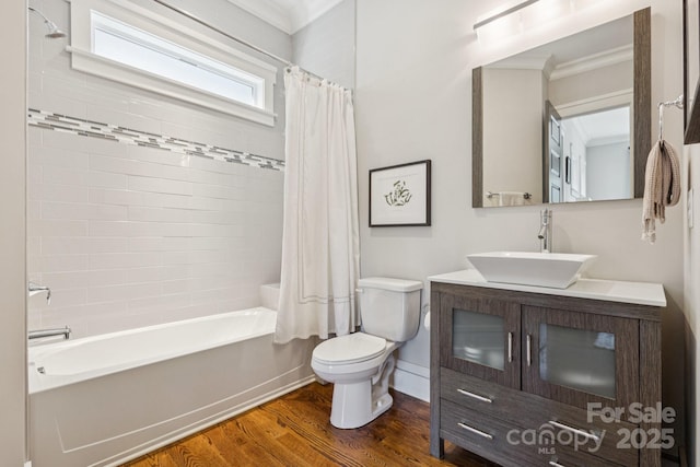 2221 Kenmore Ave, Charlotte, NC 28204 - bathroom featuring toilet, shower / bath combination with curtain, wood finished floors, vanity, and crown molding