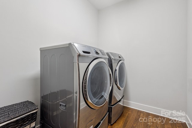 2221 Kenmore Ave, Charlotte, NC 28204 - laundry room featuring washing machine and clothes dryer, baseboards, and dark wood finished floors