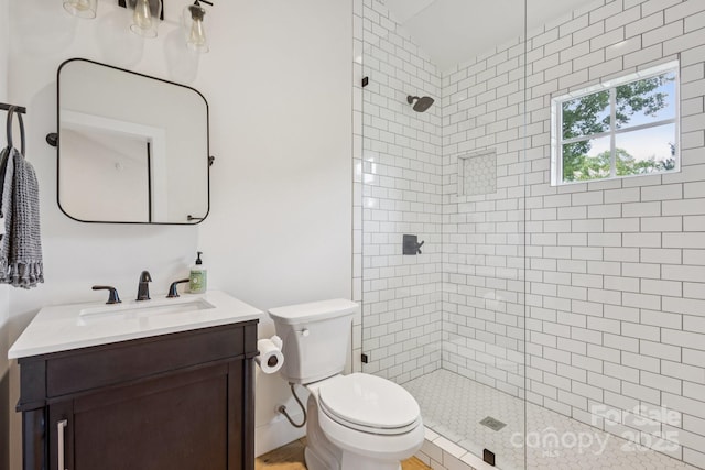 2221 Kenmore Ave, Charlotte, NC 28204 - full bathroom with tiled shower, vanity, and toilet